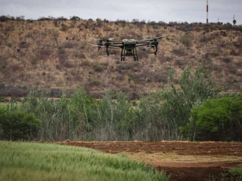  Aerial surveying drone capturing terrain data across a large property for site planning in Savannah Georgia.
