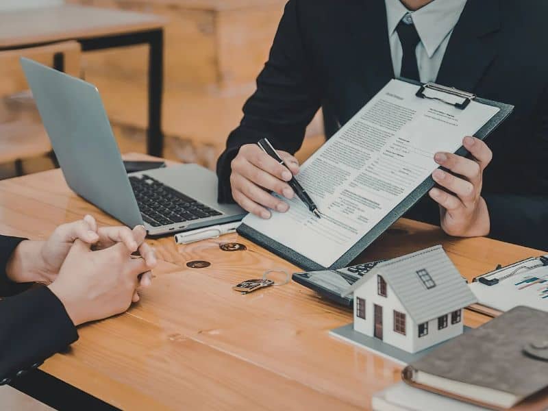 Homebuyer reviewing property documents during the mortgage closing process in Savannah, Georgia.